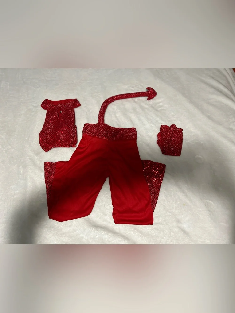 Kids Red Sequin Devil Costume Set comes with pants, top, gloves and pitchfork.